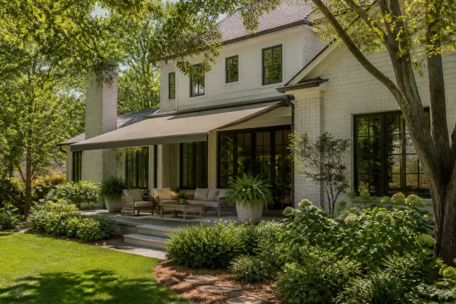 Exterior shading and landscaping around a sunny American home.